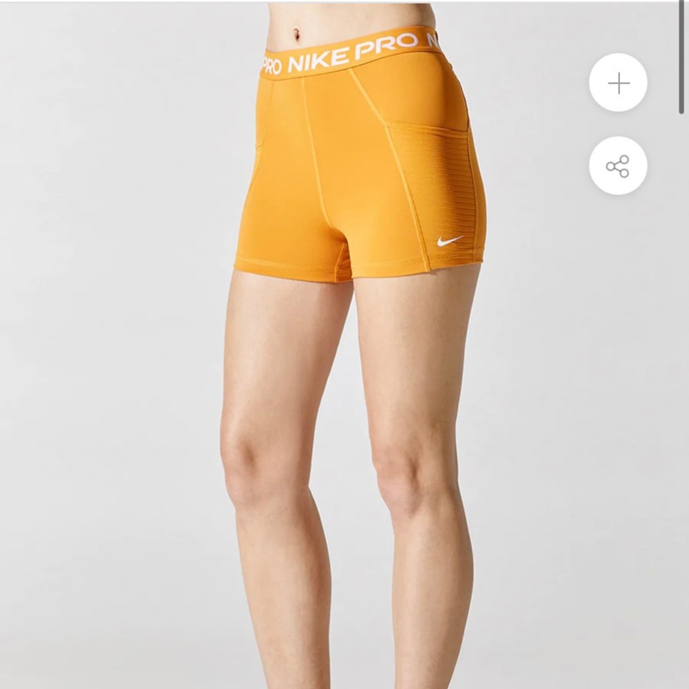 Orange Nike pro shorts